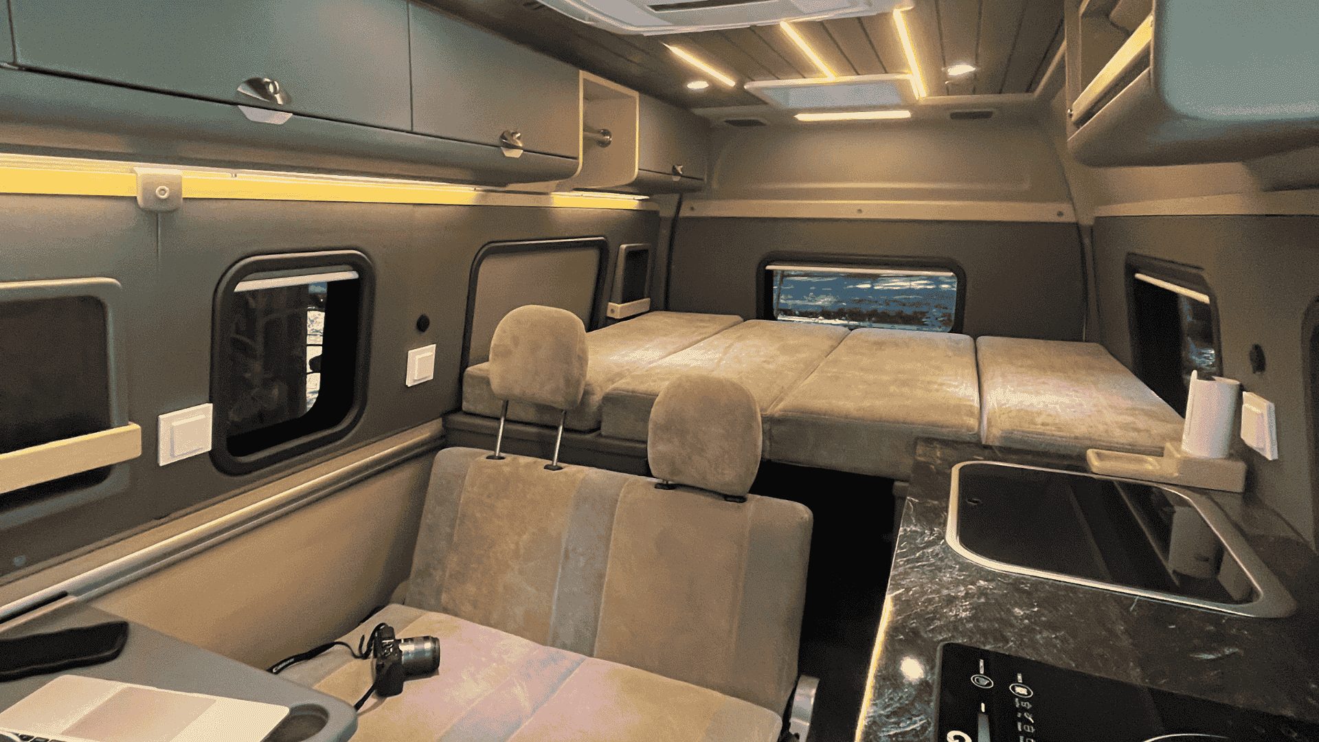 Clean and organized interior shelving of the Nomora campervan
