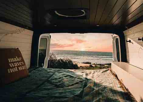Campervan driving on a scenic mountain road